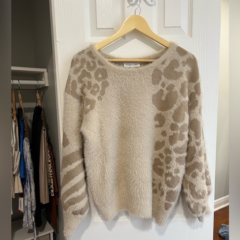 Neutral fuzzy animal print sweater in cream. Size small.